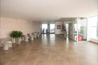 an empty lobby with chairs and a wall of windows at Apartamento en la Boquilla, Cartagena in Cartagena de Indias
