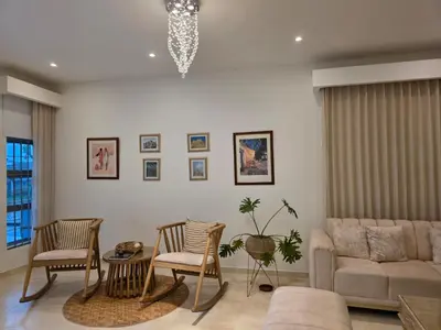 a living room with a couch and chairs at Casa Chongui in Lorica