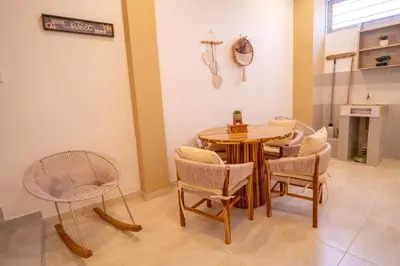 a dining room with a table and chairs at Casa Chongui in Lorica