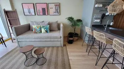 a living room with a couch and two stools at View, exit to Playa Morros tres Cartagena in Cartagena de Indias
