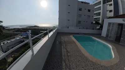 a view of a swimming pool on the balcony of a building at Casa cerca al mar Zona Norte Cielo Mar Cartagena in Cartagena de Indias