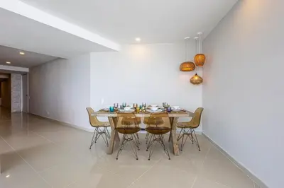 a dining room with a table and chairs at Luxurious Beachfront 3BR, Pool & Ocean Views in Cartagena de Indias