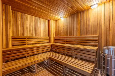 a row of wooden benches in a sauna at Luxurious Beachfront 3BR, Pool & Ocean Views in Cartagena de Indias