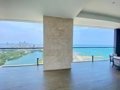 a living room with a large view of the ocean at Sunsets in El Cabrero - Cartagena in Cartagena de Indias