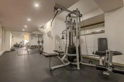 a gym with several tread machines in a room at Morros 3, 1 Bedroom & Seaview in Cartagena de Indias