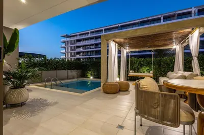 a patio with a table and a pool and a building at Luxury Oasis Private Pool Wine BBQ and Sea in Cartagena de Indias