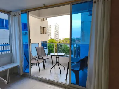 a balcony with a table and chairs and a view at Apartamento con vista al Laguito, Nuevo Conquistador in Cartagena de Indias