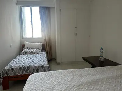 a small bedroom with a bed and a window at Cristoforo Colombo CARTAGENA