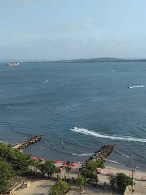 a view of a beach with a boat in the water at Apartamento cerca Bocagrande in Cartagena de Indias