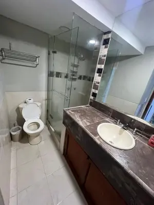 a bathroom with a toilet and a sink and a shower at ApartaEstudio cerca a Bocagrande in Cartagena de Indias
