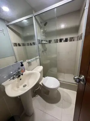 a bathroom with a toilet and a sink and a shower at ApartaEstudio cerca a Bocagrande in Cartagena de Indias