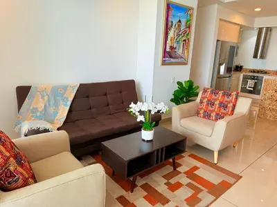 a living room with a couch and two chairs and a table at Moderno Apartamento 1504 in Cartagena de Indias