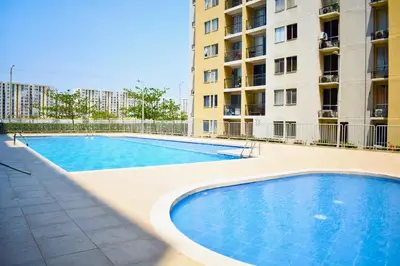 a swimming pool in front of a apartment building at Luxury Apartament With Pool in Barranquilla