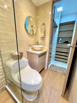 a bathroom with a toilet and a sink at Luxury Apartament With Pool in Barranquilla