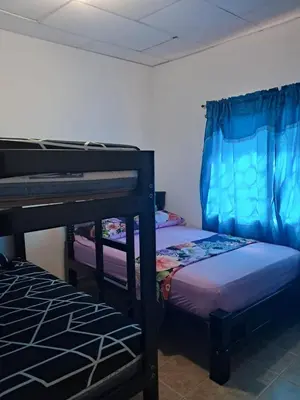 a bedroom with two bunk beds in a room at Hospedaje Mango y Mar Apartamento in Coveñas