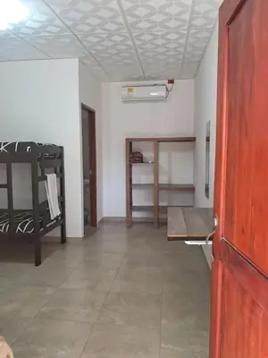 an empty room with a room with a door and a room with a room at Hospedaje Mango y Mar Habitaciones in Coveñas