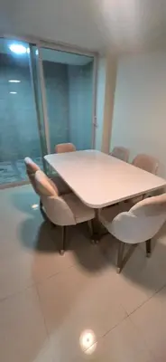 a meeting room with a white table and chairs at Casa 4 Barrio El Prado in Barranquilla