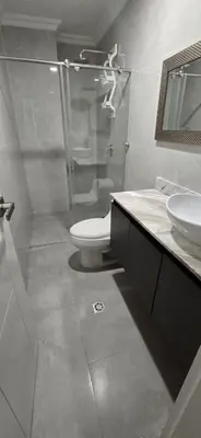a bathroom with a shower and a toilet and a sink at Casa 4 Barrio El Prado in Barranquilla