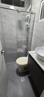 a bathroom with a shower and a toilet and a sink at Casa 4 Barrio El Prado in Barranquilla