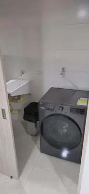 a television sitting in a bathroom with a sink at Apartamento Plazuela Portal Del Prado in Barranquilla