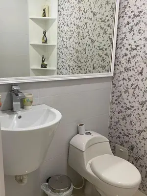 a white bathroom with a sink and a toilet at Apartamento con excelente Vista al Mar in Cartagena de Indias