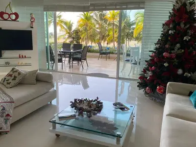 a living room with a couch and a christmas tree at Apartamento con excelente Vista al Mar in Cartagena de Indias