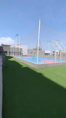 a volleyball court with a net in a field at Apartamento moderno en norte de la ciudad in Barranquilla