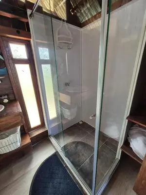 a shower with a glass door in a room at Veleta Playa Calao in San Antero