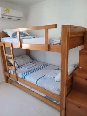 a couple of bunk beds in a room at Conjunto Residencial Caribe Campestre in Coveñas