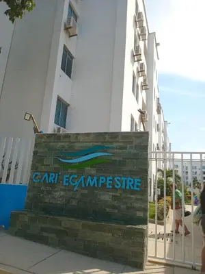 a sign in front of a building at Conjunto Residencial Caribe Campestre in Coveñas