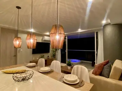 a living room with a table and a couch at Exclusivo Apto En Dominique Cartagena in Cartagena de Indias