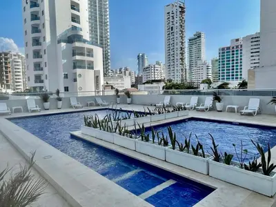 a swimming pool on the roof of a building at Apartamento playa Bocagrande Los Delfines Cartagena in Cartagena de Indias