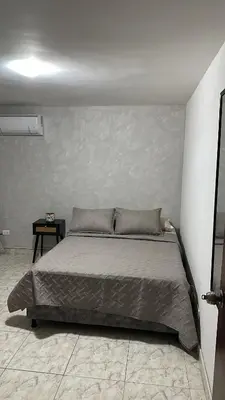 a bedroom with a large bed in a room at Apartamento 84 - 2 habitaciones in Barranquilla
