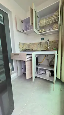 a kitchen with a desk and shelves in a room at Loft MR1-4G facing the sea in a high level neighborhood in Cartagena de Indias
