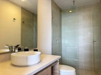 a bathroom with a sink and a shower at Spectacular Beachfront Apartment in Cartagena de Indias