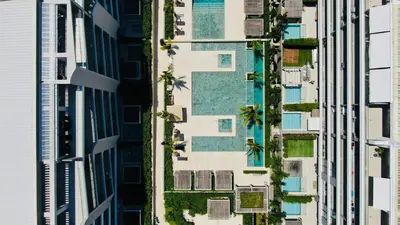 an overhead view of a tall building with swimming pools at Spectacular Beachfront Apartment in Cartagena de Indias