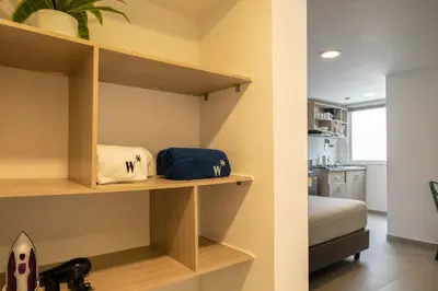 a room with shelves and a bed in a room at Serene Bay by Wynwood House in Cartagena de Indias