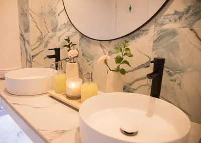 a bathroom with a sink and a mirror at Playa Banana Manzanillo del Mar in Cartagena de Indias