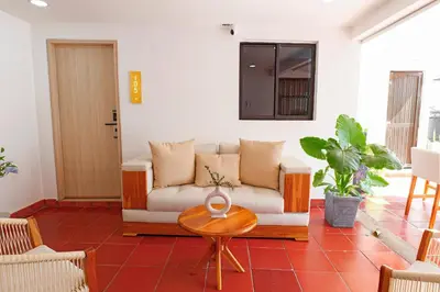 a living room with a couch and a table at Mishka Hotel Boutique Habitación 103 in Cartagena de Indias