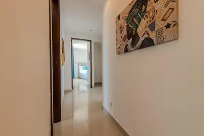 a hallway with a painting hanging on a wall at The best Luxury Suite in Cartagena in Cartagena de Indias