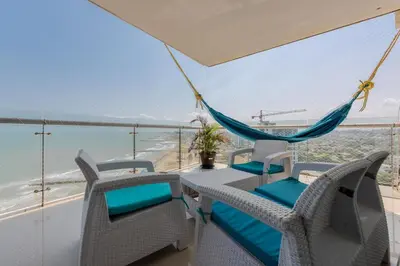 a balcony with a hammock and a view of the ocean at The best Luxury Suite in Cartagena in Cartagena de Indias