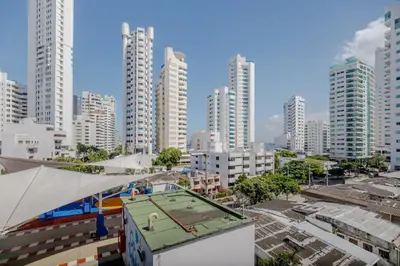 a tennis court on top of a building in a city at Spacious apartment in Bocagrande near the sea in Cartagena de Indias