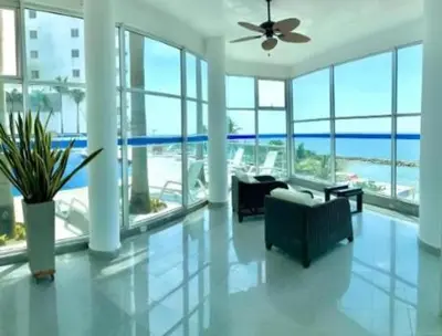 a living room with a view of the ocean at Tu lugar favorito en Cartagena in Cartagena de Indias