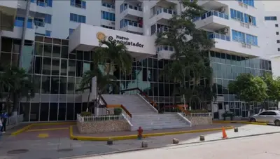 a large building with stairs in front of it at Bahía Caribe in Estación El Salto