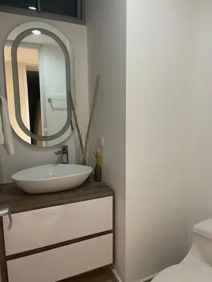 a bathroom with a sink and a mirror at Mistral Exclusive oceanfront apartment with balcony in Cartagena de Indias