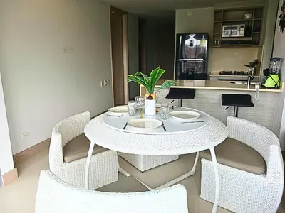 a white table and chairs in a kitchen at Apartamento en condominio de lujo morros eco. in Cartagena de Indias