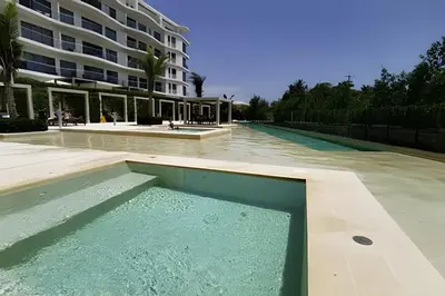 a swimming pool in front of a building at Apartamento en condominio de lujo morros eco. in Cartagena de Indias
