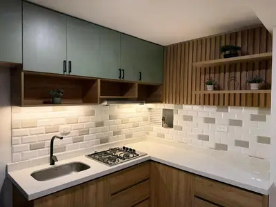 a kitchen with a sink and a stove at APTO LODGE - Confortable y acogedor apartamento al norte de Barranquilla vía a Puerto Colombia in Barranquilla
