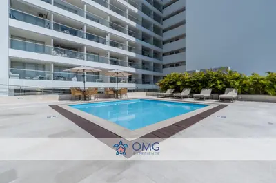 a swimming pool in front of a building at Suite de Lujo Frente al Mar CB1525 in Cartagena de Indias