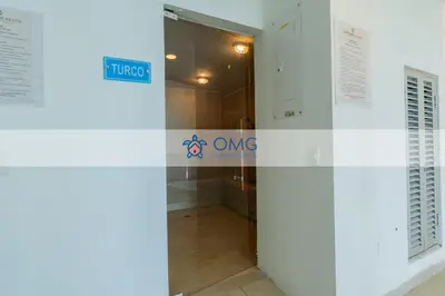 an entrance to a building with a sign on the door at Suite de Lujo Frente al Mar CB1525 in Cartagena de Indias